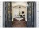 Inviting foyer with decorative tile flooring, elegant chandelier, and stylish decor at 2300 E Sanoque Ct, Gilbert, AZ 85298