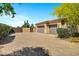 Spacious three-car garage and gated entrance on a paved driveway at 2300 E Sanoque Ct, Gilbert, AZ 85298