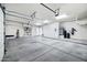 Spacious 3-car garage with lots of storage and tall ceilings at 2300 E Sanoque Ct, Gilbert, AZ 85298
