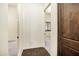 Hallway shows a dark wooden door with views into other rooms at 2300 E Sanoque Ct, Gilbert, AZ 85298