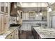 Stylish kitchen boasting custom cabinetry, granite countertops, and a large island at 2300 E Sanoque Ct, Gilbert, AZ 85298