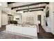 Open living space with beamed ceilings, fireplace, and stylish furnishings at 2300 E Sanoque Ct, Gilbert, AZ 85298