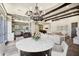 Open-concept living area featuring a dining table, kitchen, and living room at 2300 E Sanoque Ct, Gilbert, AZ 85298
