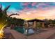 Inviting pool and outdoor living space, perfect for relaxing and entertaining with desert landscaping at 2300 E Sanoque Ct, Gilbert, AZ 85298