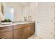 Bathroom boasts elegant wallpaper, granite countertop, and modern vanity at 23038 E Nightingale Rd, Queen Creek, AZ 85142