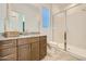 Modern bathroom with tile flooring, glass shower, and granite countertop vanity at 23038 E Nightingale Rd, Queen Creek, AZ 85142