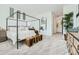 Primary bedroom showcasing a four-poster bed, neutral decor, and natural light at 23038 E Nightingale Rd, Queen Creek, AZ 85142