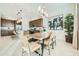 Dining room featuring an open floor plan with a modern kitchen and eating space at 23038 E Nightingale Rd, Queen Creek, AZ 85142