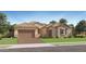 Charming single-story home with a stone accent, a tile roof, and a two-car garage at 23038 E Nightingale Rd, Queen Creek, AZ 85142