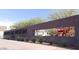 Phoenix Art Museum sign with a red dinosaur statue behind the sign at 2323 N Central Ave # Ph D, Phoenix, AZ 85004