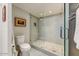 Well-lit bathroom with a glass shower and decorative art piece at 2323 N Central Ave # Ph D, Phoenix, AZ 85004