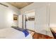 A well-lit bedroom has a modern closet with sliding doors for storage at 2323 N Central Ave # Ph D, Phoenix, AZ 85004
