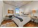 Well-lit bedroom with wood floors, a desk and chair, and plenty of natural light at 2323 N Central Ave # Ph D, Phoenix, AZ 85004