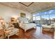 Bright bedroom with a stylish chair, a comfortable chaise lounge and an incredible city view at 2323 N Central Ave # Ph D, Phoenix, AZ 85004
