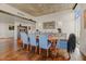 Dining room with hardwood floors, artwork, and a modern dining table and chairs at 2323 N Central Ave # Ph D, Phoenix, AZ 85004
