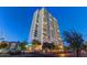 A luxurious high rise boasts multiple balconies against a vibrant blue sky and lush green trees at 2323 N Central Ave # Ph D, Phoenix, AZ 85004