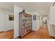 Long hallway features hardwood floors, a bookcase and architectural details throughout at 2323 N Central Ave # Ph D, Phoenix, AZ 85004