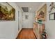 Bright hallway with unique artwork and hardwood flooring at 2323 N Central Ave # Ph D, Phoenix, AZ 85004