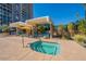 Relaxing hot tub area with shaded cabanas and comfortable lounge seating near the community pool at 2323 N Central Ave # Ph D, Phoenix, AZ 85004