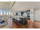 Modern kitchen with an island, breakfast bar, stainless steel appliances, and hardwood floors at 2323 N Central Ave # Ph D, Phoenix, AZ 85004