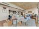Open-concept living room with modern furnishings, hardwood floors, and kitchen in background at 2323 N Central Ave # Ph D, Phoenix, AZ 85004