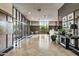 Elegant lobby area featuring wood paneled walls, tile floors, a reception desk, and ample natural light at 2323 N Central Ave # Ph D, Phoenix, AZ 85004