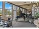 Sophisticated lounge area with a piano, comfortable seating, large windows, and modern decor at 2323 N Central Ave # Ph D, Phoenix, AZ 85004