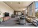 Lounge area with comfortable seating, large windows, a bar, and a television for relaxing and entertaining at 2323 N Central Ave # Ph D, Phoenix, AZ 85004