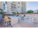 Beautiful outdoor kitchen includes a grill and bar overlooking the city apartments at 2323 N Central Ave # Ph D, Phoenix, AZ 85004