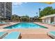 Inviting community pool area with lounge chairs, umbrellas, and a poolside cabana at 2323 N Central Ave # Ph D, Phoenix, AZ 85004