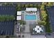 Aerial view of a resort-style pool and outdoor recreational space with lounge chairs and patio seating at 2323 N Central Ave # Ph D, Phoenix, AZ 85004