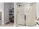 Bathroom with a walk-in shower and built in shelving at 235 S 190Th Ave, Buckeye, AZ 85326