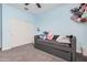 Bedroom with light blue walls, gray carpet and a small trundle bed at 235 S 190Th Ave, Buckeye, AZ 85326