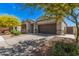 Beautiful one-story home with a two-car garage, landscaped front yard, and inviting walkway at 235 S 190Th Ave, Buckeye, AZ 85326