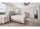 Spacious main bedroom with a vaulted ceiling, plush carpet, and lots of natural light at 235 S 190Th Ave, Buckeye, AZ 85326