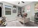 Cozy office with posters and a comfy brown leather chair situated at a modern desk; perfect workspace at 235 S 190Th Ave, Buckeye, AZ 85326