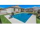 Inviting backyard pool with a gazebo, lounge chairs, and a basketball hoop perfect for outdoor entertaining at 235 S 190Th Ave, Buckeye, AZ 85326