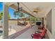 Expansive backyard with covered patio, grilling area, seating, and a charming pergola, perfect for entertaining at 2454 W Camp River Rd, Queen Creek, AZ 85144
