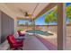 Charming backyard featuring a sparkling pool, outdoor seating, and a serene atmosphere at 2454 W Camp River Rd, Queen Creek, AZ 85144