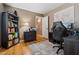 Functional bedroom with hardwood floors, ample desk and storage space at 2454 W Camp River Rd, Queen Creek, AZ 85144