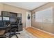 Functional bedroom with hardwood floors, ample desk and storage space at 2454 W Camp River Rd, Queen Creek, AZ 85144