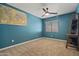 A bright bedroom offers carpeted floors, a ceiling fan, and a lofted bed at 2454 W Camp River Rd, Queen Creek, AZ 85144
