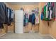 Walk-in closet with ample hanging space and built-in storage at 2454 W Camp River Rd, Queen Creek, AZ 85144