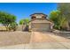 Charming two-story home featuring a two-car garage and desert landscaping at 2454 W Camp River Rd, Queen Creek, AZ 85144