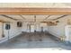 Spacious two-car garage with ample storage and water softener system at 2454 W Camp River Rd, Queen Creek, AZ 85144