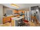 Updated kitchen offers ample counter space, stainless steel appliances, and a cozy breakfast bar at 2454 W Camp River Rd, Queen Creek, AZ 85144