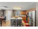 Modern kitchen boasts stainless steel appliances, a breakfast bar, and an open layout at 2454 W Camp River Rd, Queen Creek, AZ 85144