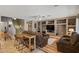 Relaxing living room features custom built-ins, comfortable seating, and a stylish bar area at 2454 W Camp River Rd, Queen Creek, AZ 85144