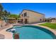 Sparkling in-ground pool and covered patio for relaxing in the backyard at 2454 W Camp River Rd, Queen Creek, AZ 85144