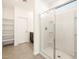 Modern bathroom with tiled floors and a glass-enclosed shower at 2668 E San Miguel Dr, Casa Grande, AZ 85194
